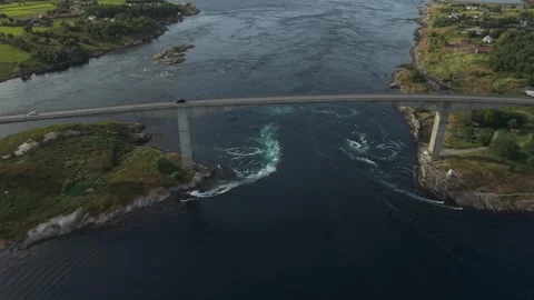 A Bridge Spans Powerful Swirling Currents as Tidal Waters Rush Through the Stock Footage 326032017
