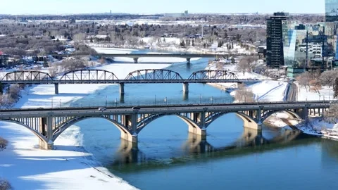 Bridge spans a river with snow on the ground Stock Footage 301363340