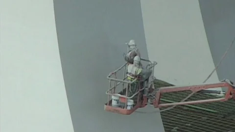 Bridge spray painters low on column Stock Footage 105553234
