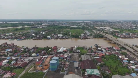 The bridge that stretches across the wide river is filled with vehicle acti.. Stock Footage 334274462