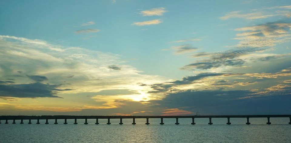 Bridge with Sunset Behind Clouds Stock Photos