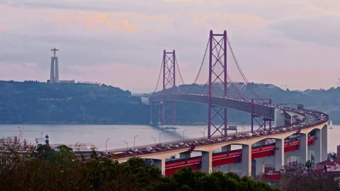 Bridge at sunset from Miradouro do Bairro do Alvito tourist viewpoint with Tagus Stock Footage 305104279