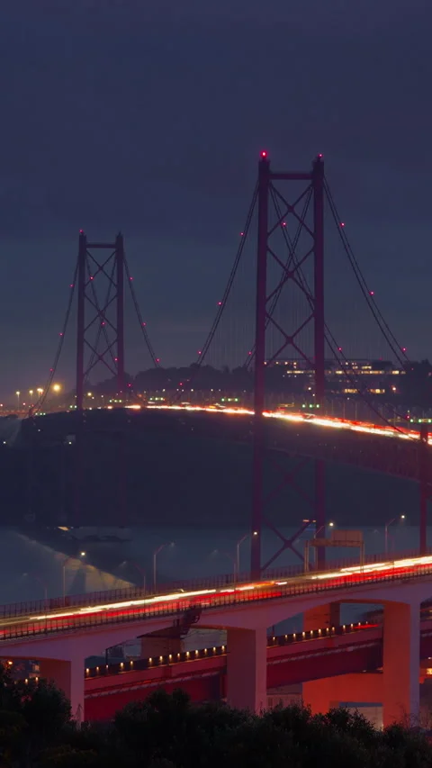 Bridge at sunset from Miradouro do Bairro do Alvito tourist viewpoint with Tagus Stock Footage 315190151