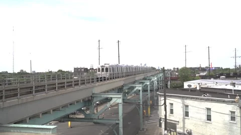 The bridge is at sunset, the train is approaching. High-speed express. Stock Footage 225534288