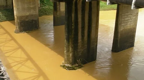 Bridge Supporting  Columns on Muddy River Stock Footage 8563675