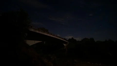 Bridge &amp; Thin clouds on night sky - time lapse Stock Footage 124094338