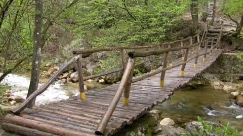 Bridge through mountain small river. Stock Footage
