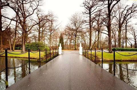 Bridge through the river view on bridge through the channel to the park Co... Fotos Stock