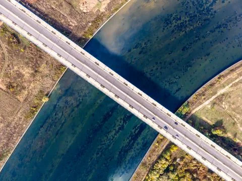 Bridge top high diagonal view blue river Stockfoto's