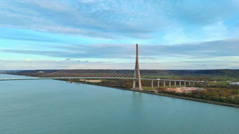Bridge tower and cable pattern above calm water Stock Footage 338258534