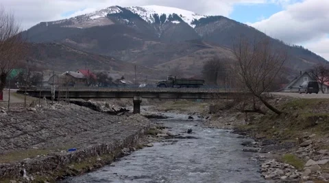 Bridge Traffic With Snowy Mountains Background Stock Footage 61872947