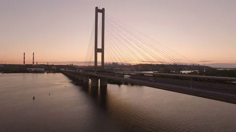 Bridge with trafic over the river at sunset aerial drone footage Stock Footage 84977407