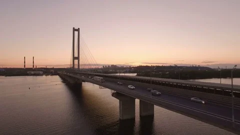 Bridge with trafic over the river at sunset aerial drone footage Stock Footage 84981130