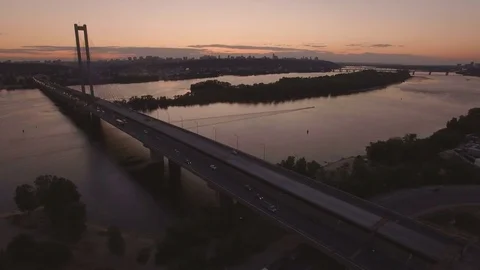 Bridge with trafic over the river at sunset aerial drone footage Stock Footage 84984330