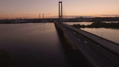 Bridge with trafic over the river at sunset aerial drone footage Stock Footage 85047121