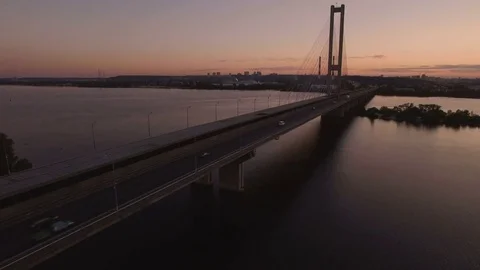 Bridge with trafic over the river at sunset aerial drone footage Stock Footage 85048872