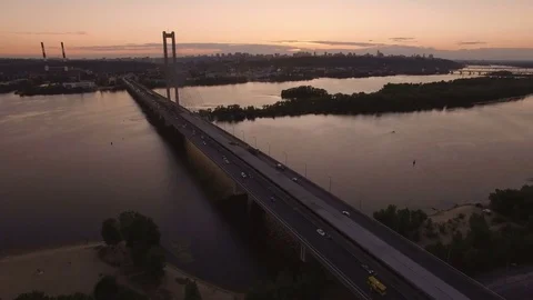 Bridge with trafic over the river at sunset aerial drone footage Stock Footage 85082534