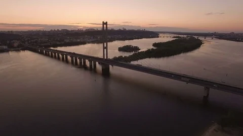 Bridge with trafic over the river at sunset aerial drone footage Stock Footage 85083934
