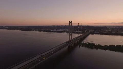 Bridge with trafic over the river at sunset aerial drone footage Stock Footage 85085585