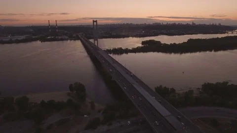 Bridge with trafic over the river at sunset aerial drone footage Stock Footage 85090078