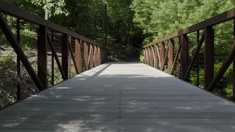 A Bridge On A Trail In A Park Stock Footage 87399739