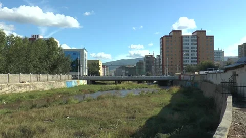 A bridge on the Tuul river runs through the Ulaanbaatar city, Mongolia. Video stock 303728585