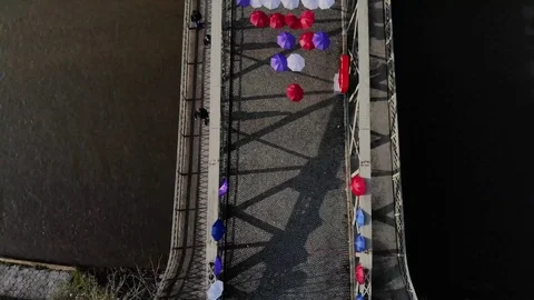 Bridge with umbrellas Stock Footage 87765663