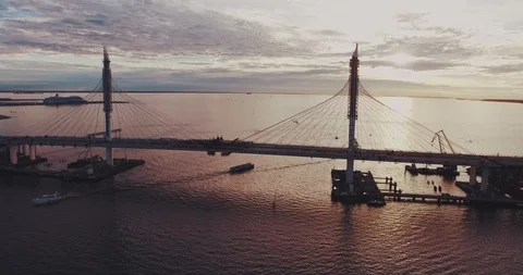 Bridge under construction during sunset in a middle of the lake Video stock 124645166