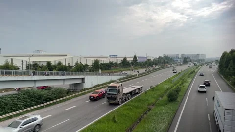Bridge-view-looking-down-at-highway-near-industrial-park Stock Footage 340471877