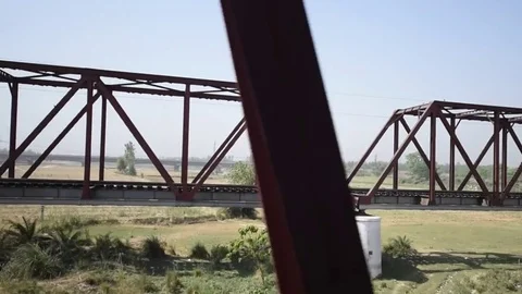 Bridge view from train window Stock Footage 77156176