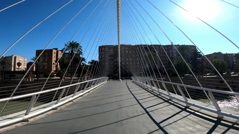 Bridge walking in slow motion. Scenic view of suspended bridge over river Vídeos de archivo 143010352