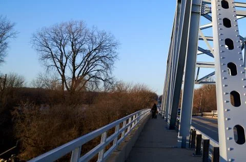 Bridge Walkway with beautiful tree lines and blue sky. Фото
