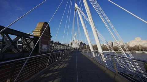 A bridge with a white railing and a clear blue sky Stock Footage 297860131