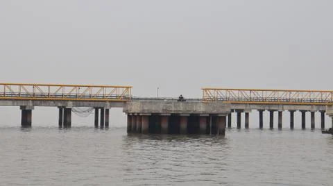 Bridges connecting a  floating platform located near the sea port. Stock Photos