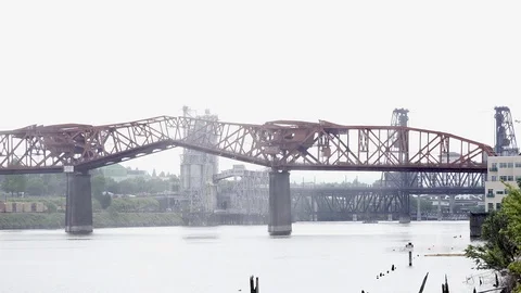 Bridges going up on river for ship - 4K Stock Footage 107815753