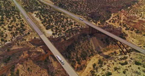Bridges joining the sides of huge ditch in the land of a desert.  Video stock 212960773