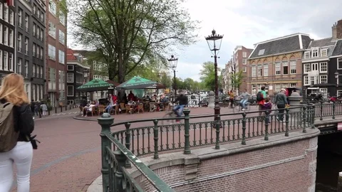 Bridges of Leidsegracht, Amsterdam. People and boats traffic. Stock Footage