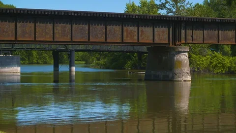 Bridges over river from shore at 60fps Stock Footage 128661992