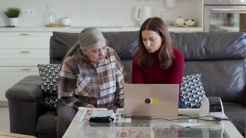 Bridging the Generation Gap Mom and Daughter Team Up for Online Business Success Stock Footage 312312179