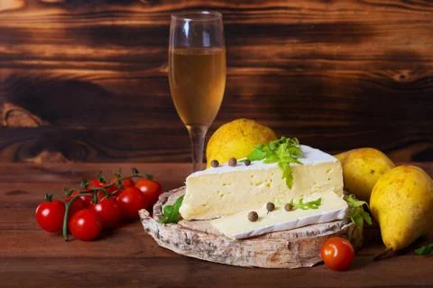 Brie cheese with cherry tomatoes Stock Photos