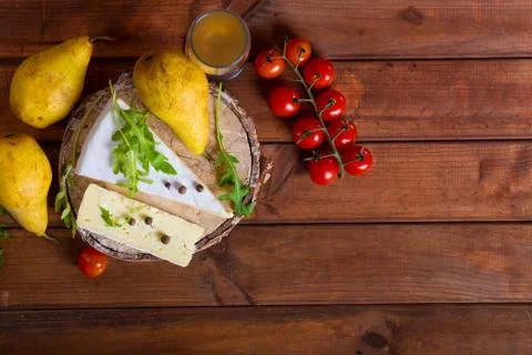 Brie cheese with cherry tomatoes Stock Photos