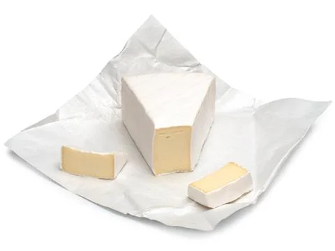 Brie cheese chunks isolated on white background Stock Photos