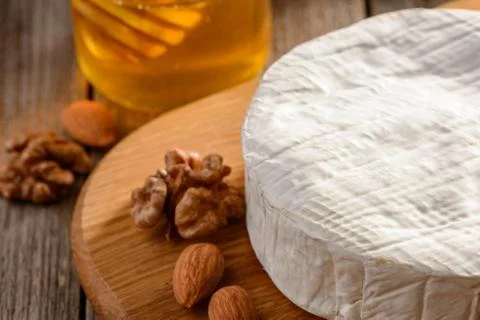 Brie cheese served with nuts Stock Photos