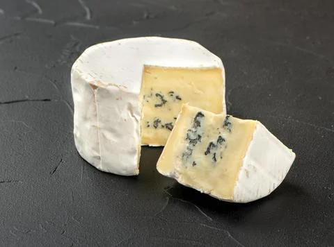 Brie cheese with slice Stock Photos