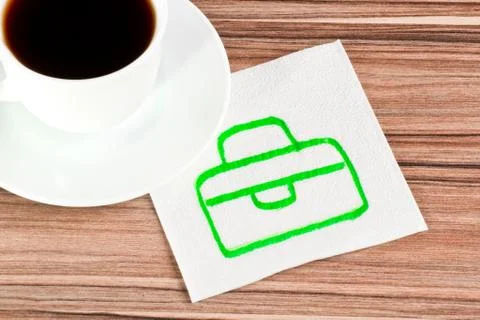 Briefcase on a napkin Stock Photos