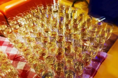 Bright abstract background based on wine glasses with motion blur focus on ce Stock Photos