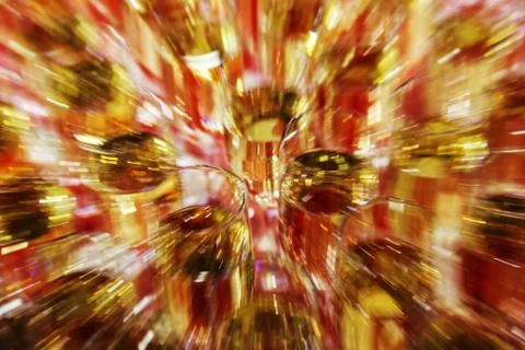 Bright abstract background based on wine glasses with motion blur focus on ce Stock Photos