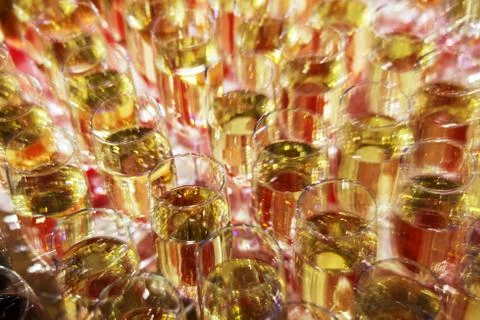 Bright abstract background based on wine glasses with motion blur focus on ce Stock Photos