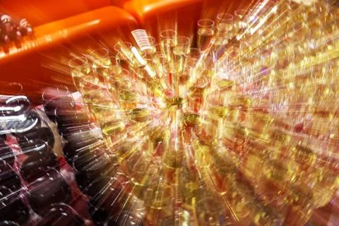 Bright abstract background based on wine glasses with motion blur focus on ce Stock Photos