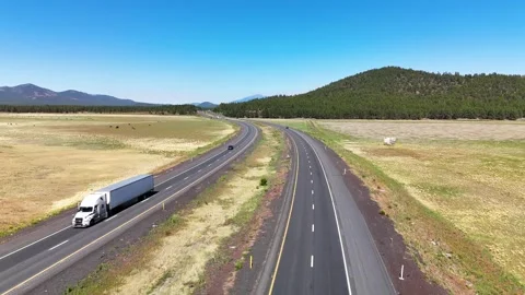 Bright aerial drone shot capturing bustling traffic on two parallel American Stock Footage 346889470